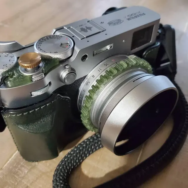 Fujifilm X100VI with green focus ring and green half-case